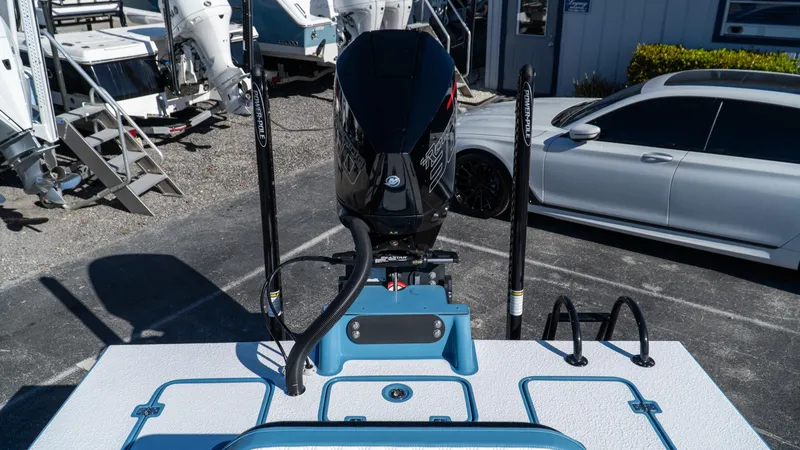  Yacht Photos Pics 2025 SCB S22 boat with powerful outboard motor in a marina setting.