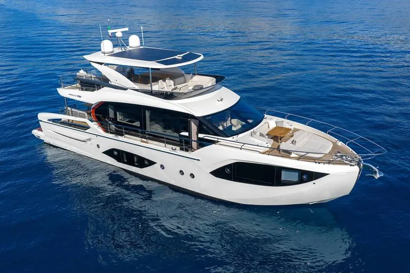  Yacht Photos Pics Luxurious 2026 Absolute 70 Fly yacht cruising on serene blue waters.