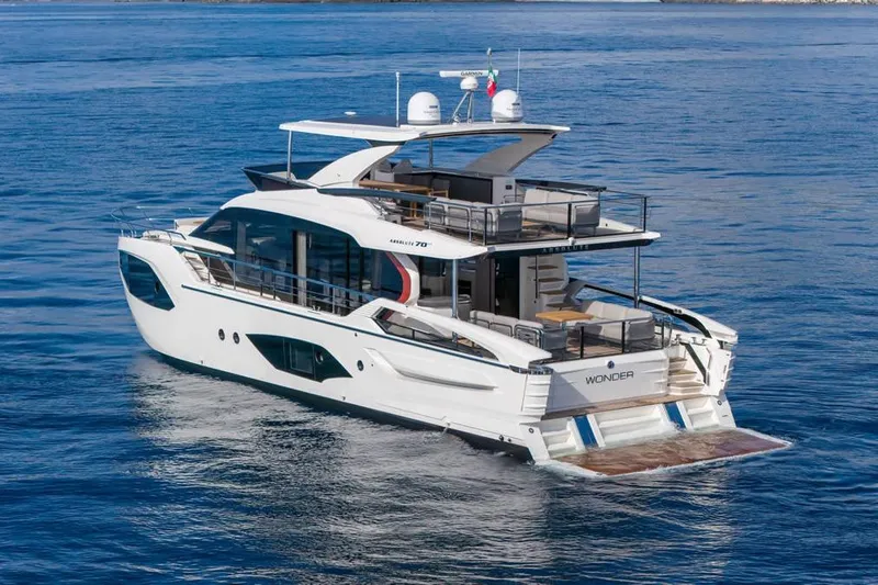  Yacht Photos Pics Luxurious 2026 Absolute 70 Fly yacht cruising on serene blue waters.