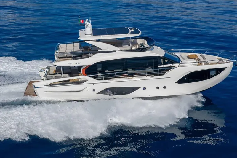  Yacht Photos Pics Luxury 2026 Absolute 70 Fly yacht cruising on open sea.