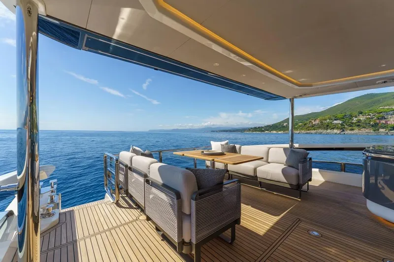  Yacht Photos Pics Luxurious 2026 Absolute 70 Fly yacht deck with ocean view and elegant seating.