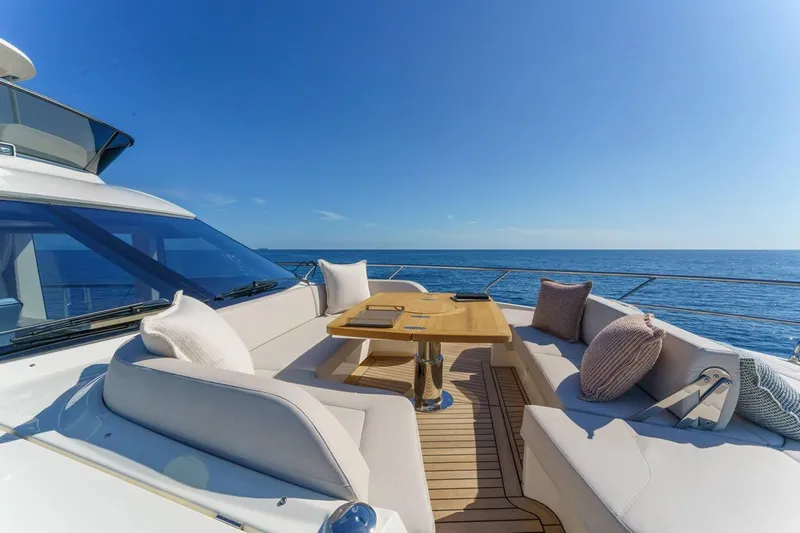  Yacht Photos Pics Luxurious Absolute 70 Fly yacht deck with elegant seating, ocean view, and clear blue sky, 2026 model.