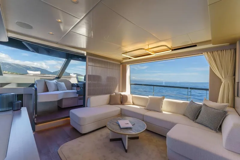  Yacht Photos Pics Luxurious interior of 2026 Absolute 70 Fly yacht with ocean view and elegant seating.
