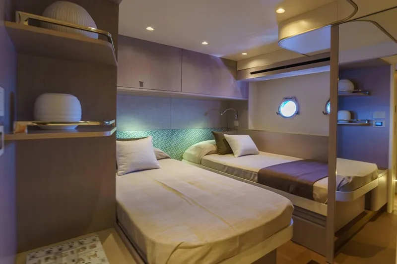  Yacht Photos Pics Luxurious twin cabin interior of 2026 Absolute 70 Fly yacht, featuring modern design and ambient lighting.