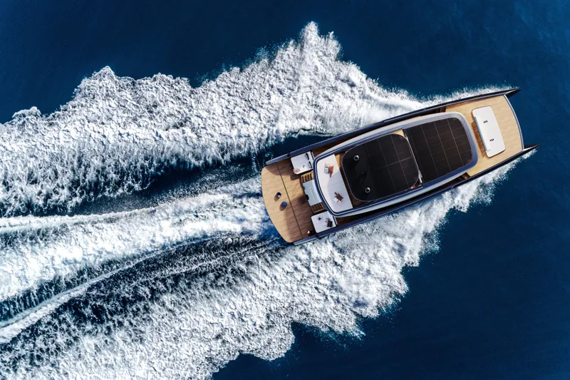  Yacht Photos Pics Aerial view of 2026 Sunreef 88 ULTIMA yacht cruising on open water.