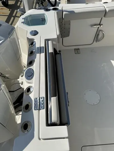  Yacht Photos Pics 2024 Sailfish 276 DC boat deck with rod holders and storage compartments.