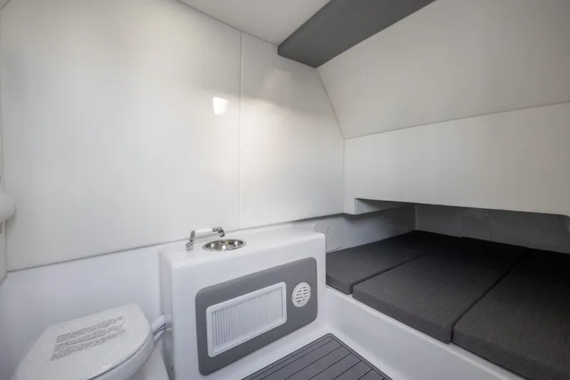  Yacht Photos Pics 2026 Front Runner 39 Center Console cabin interior with bed, sink, and toilet.