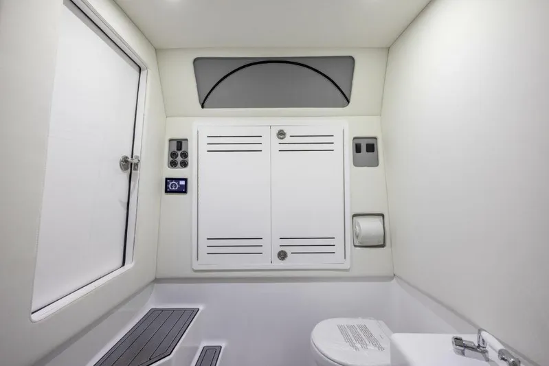  Yacht Photos Pics Interior of 2026 Front Runner 39 Center Console boat bathroom, featuring modern fixtures and storage.