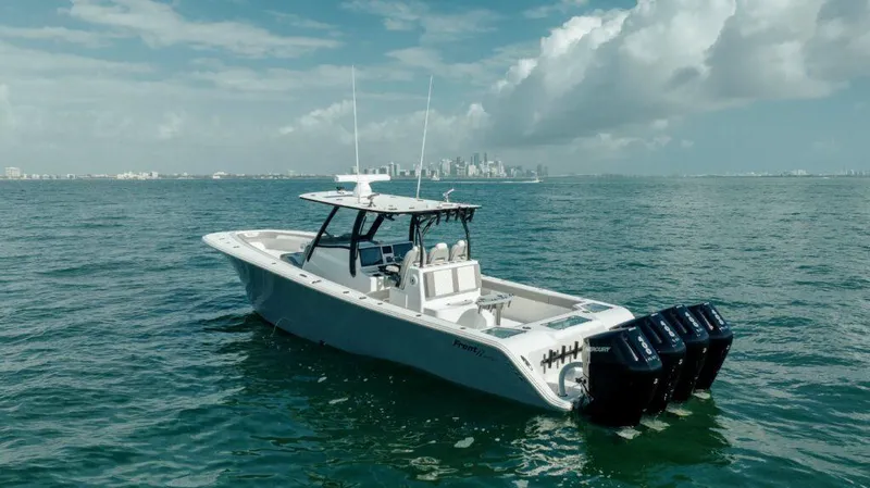  Yacht Photos Pics 2026 Front Runner 39 Center Console boat on open water with city skyline in background.