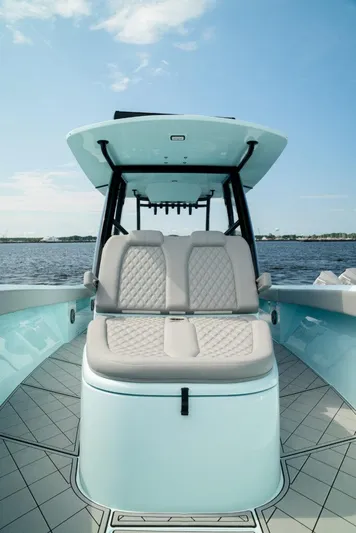  Yacht Photos Pics 2026 Front Runner 39 Center Console boat with luxurious seating on a sunny day.
