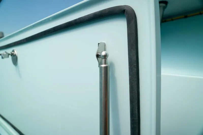  Yacht Photos Pics Close-up of a 2026 Front Runner 39 Center Console boat detail, featuring sleek metal and rubber trim.