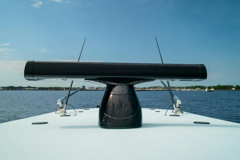  Yacht Photos Pics 2026 Front Runner 39 Center Console radar system on a boat, with a scenic water backdrop.