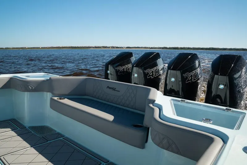  Yacht Photos Pics 2026 Front Runner 39 Center Console boat with powerful engines on a calm water backdrop.