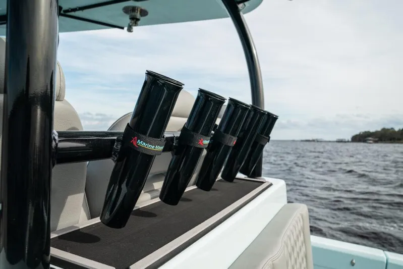 Yacht Photos Pics 2026 Front Runner 39 Center Console boat with rod holders on a calm water backdrop.