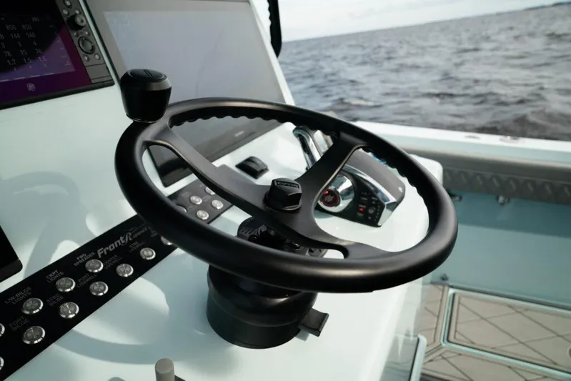  Yacht Photos Pics Steering wheel of 2026 Front Runner 39 Center Console boat with ocean view.