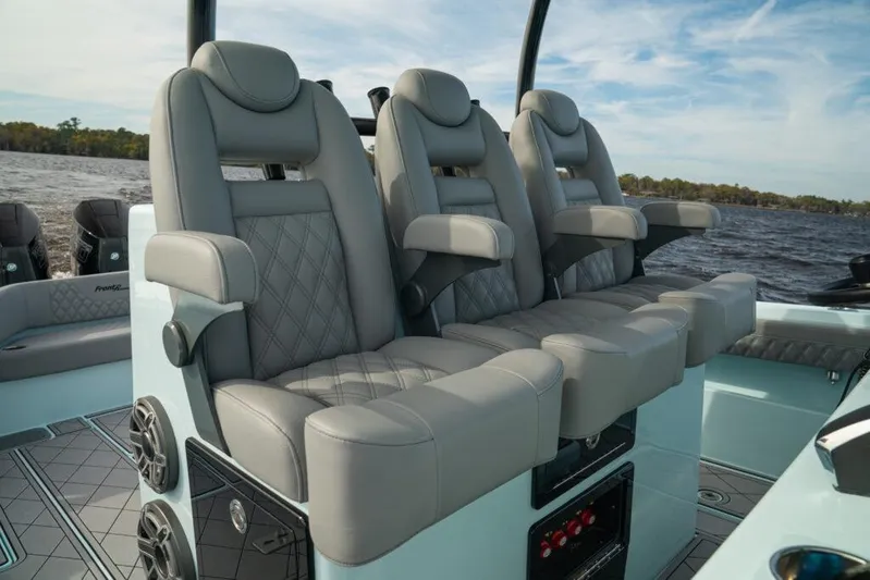  Yacht Photos Pics Luxurious seating on 2026 Front Runner 39 Center Console boat, featuring plush gray upholstery.