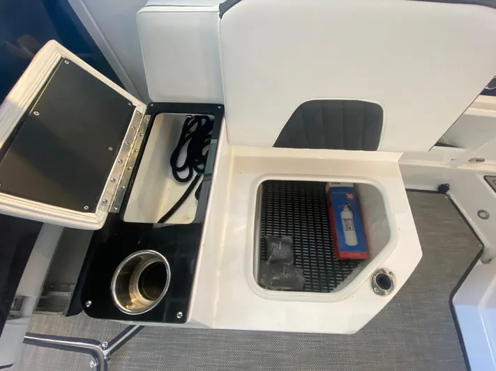  Yacht Photos Pics 2023 Monterey 298 SUPER SPORT BR boat interior with storage compartments and cup holder.