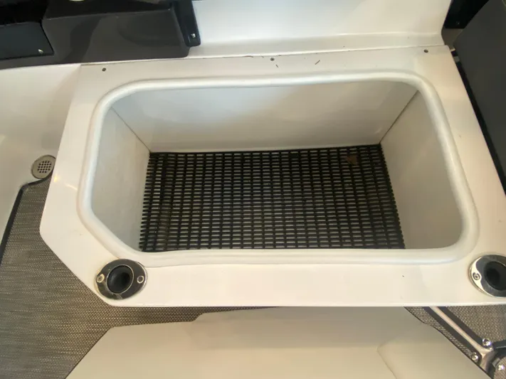  Yacht Photos Pics 2023 Monterey 298 SUPER SPORT BR boat storage compartment with non-slip mat.