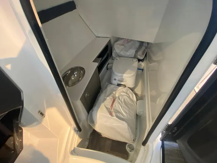  Yacht Photos Pics 2023 Monterey 298 SUPER SPORT BR boat interior with compact bathroom amenities.