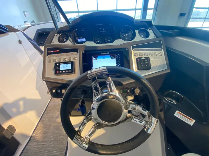  Yacht Photos Pics 2023 Monterey 298 SUPER SPORT BR dashboard with modern controls and sleek steering wheel.