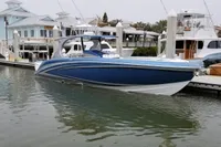 2018 Mystic Powerboats M4200, blue and white, docked in a marina.