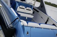 2018 Mystic Powerboats M4200, sleek blue design, luxury seating, docked by the water.