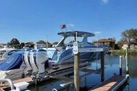 2018 Mystic Powerboats M4200 docked with triple outboard engines.