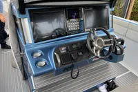 2018 Mystic Powerboats M4200 helm with dual screens and modern controls.