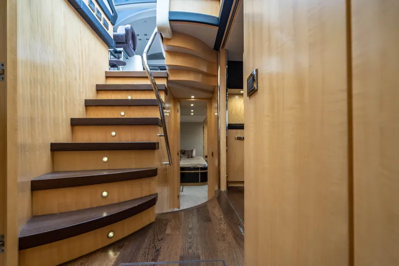 Yolo Yacht Photos Pics Interior of 2014 Sunseeker Predator yacht with wooden stairs and modern design.
