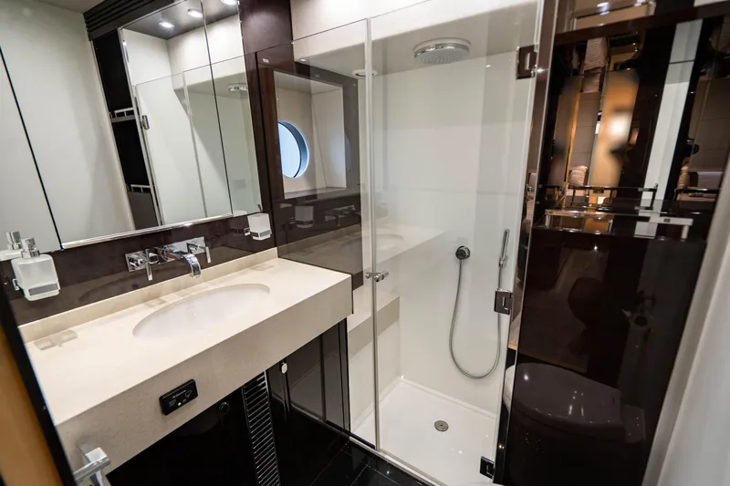 Yolo Yacht Photos Pics Modern bathroom in 2014 Sunseeker Predator yacht with glass shower and sleek vanity.