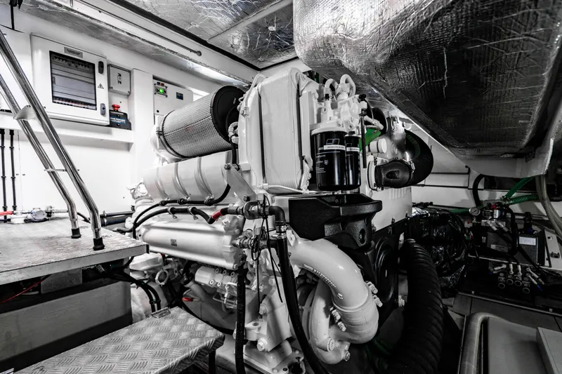 Yolo Yacht Photos Pics Engine room of a 2014 Sunseeker Predator yacht with advanced machinery.