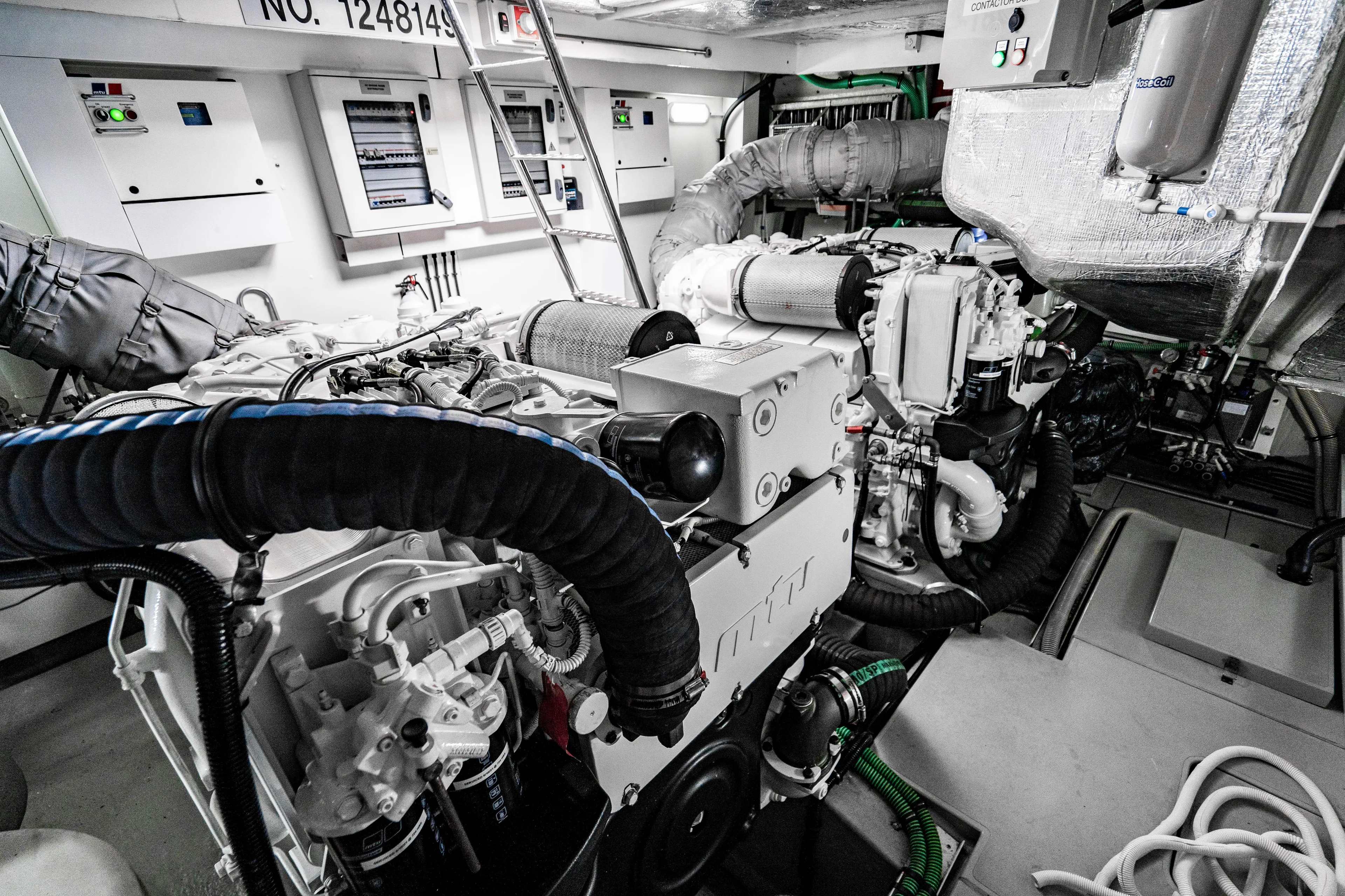 Yolo Yacht Photos Pics Engine room of a 2014 Sunseeker Predator yacht with advanced machinery and control panels.