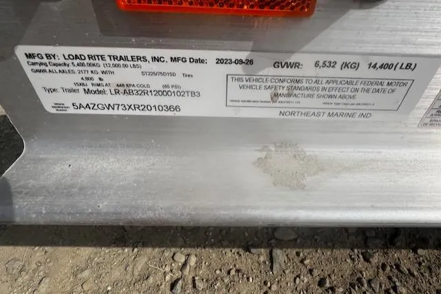  Yacht Photos Pics Label on Load Rite trailer, manufactured 2023, showing specifications and compliance details.