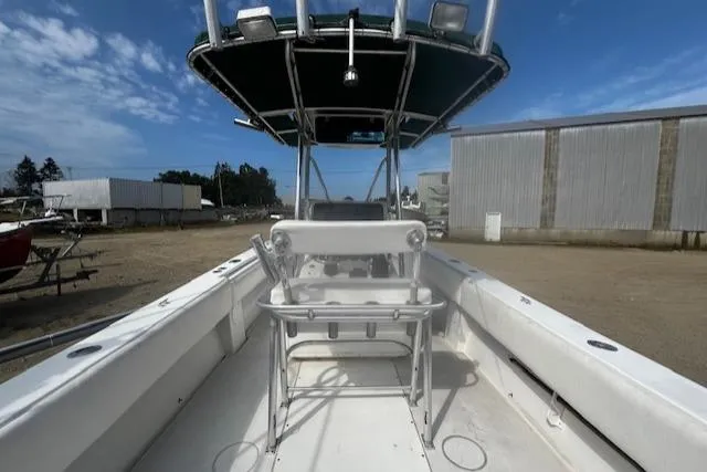  Yacht Photos Pics 1999 Contender 27 Open Center Console boat with seating, docked outdoors under a clear sky.