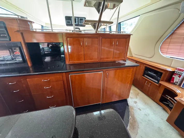 Beautiful Crazy Yacht Photos Pics Luxurious interior of 2003 Carver 570 Voyager Pilothouse with wood cabinetry and modern appliances.