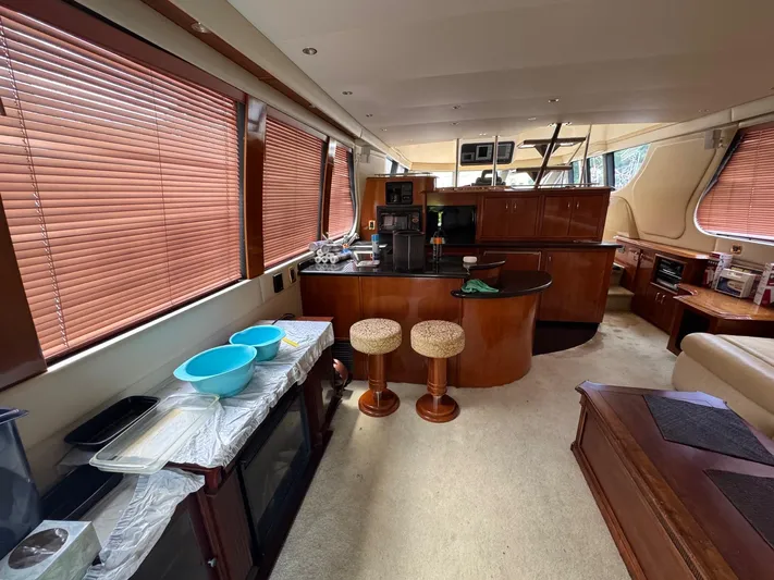 Beautiful Crazy Yacht Photos Pics Interior of 2003 Carver 570 Voyager Pilothouse with kitchen and seating area.