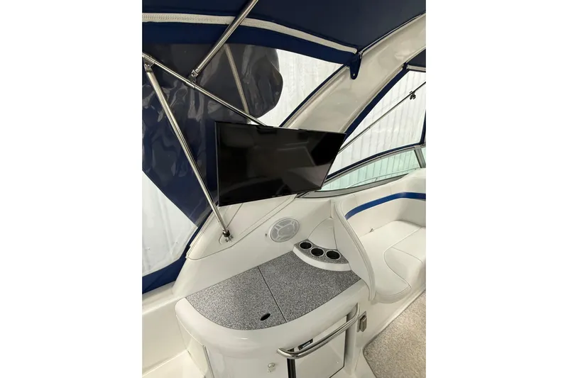  Yacht Photos Pics 2004 Formula 34 Performance Cruiser interior with TV and seating area.