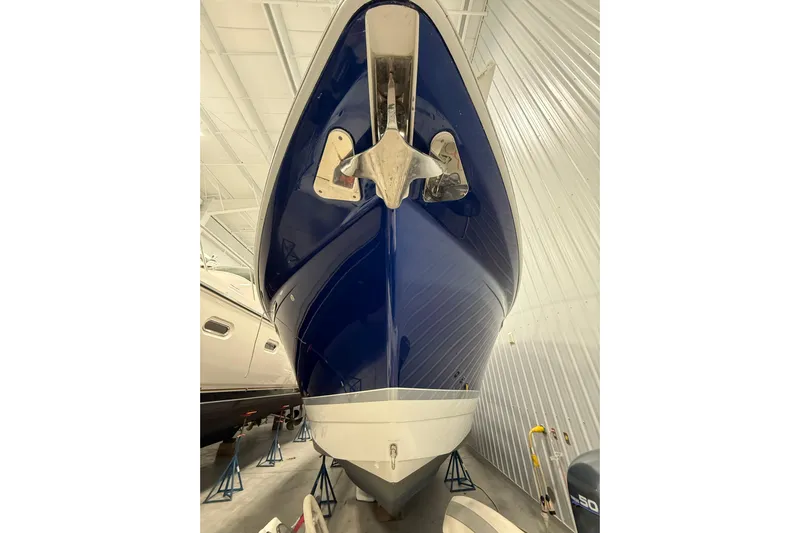  Yacht Photos Pics 2004 Formula 34 Performance Cruiser in storage, showcasing sleek blue hull design.