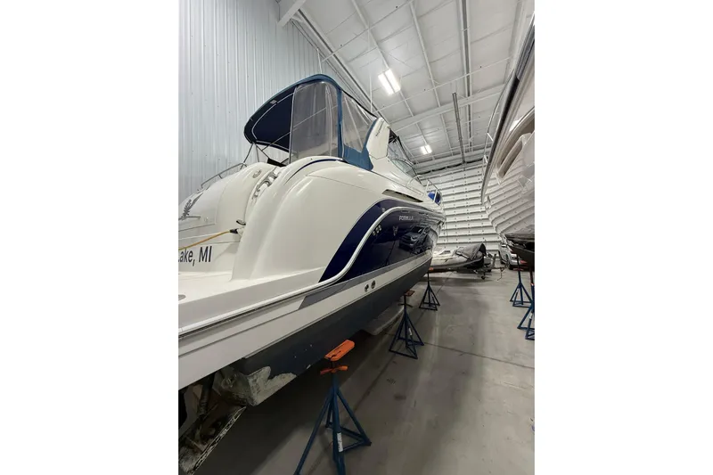  Yacht Photos Pics 2004 Formula 34 Performance Cruiser in storage, elevated on stands, inside a spacious warehouse.