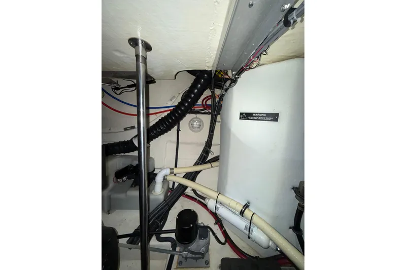  Yacht Photos Pics Engine compartment of a 2004 Formula 34 Performance Cruiser with visible wiring and pipes.