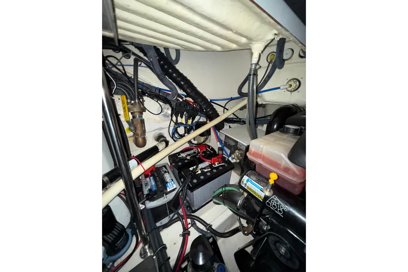  Yacht Photos Pics Engine compartment of 2004 Formula 34 Performance Cruiser with visible wiring and components.