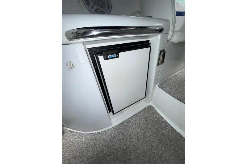  Yacht Photos Pics 2004 Formula 34 Performance Cruiser interior with compact refrigerator.