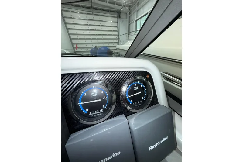  Yacht Photos Pics 2004 Formula 34 Performance Cruiser dashboard with Raymarine equipment and RPM gauges.