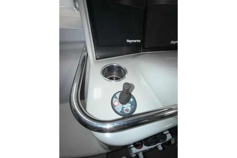  Yacht Photos Pics Control panel of a 2004 Formula 34 Performance Cruiser with joystick and cup holder.