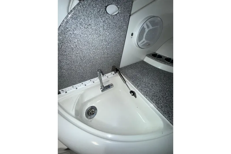  Yacht Photos Pics 2004 Formula 34 Performance Cruiser interior sink and countertop with speaker detail.