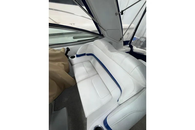  Yacht Photos Pics 2004 Formula 34 Performance Cruiser interior with white seating and blue accents.