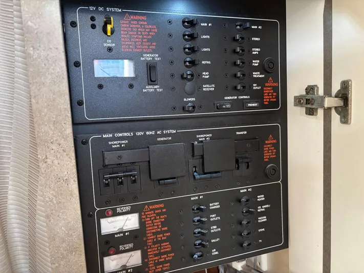 Cookin' Yacht Photos Pics Electrical control panel in a 2008 Formula 37 PC boat, featuring switches and circuit breakers.