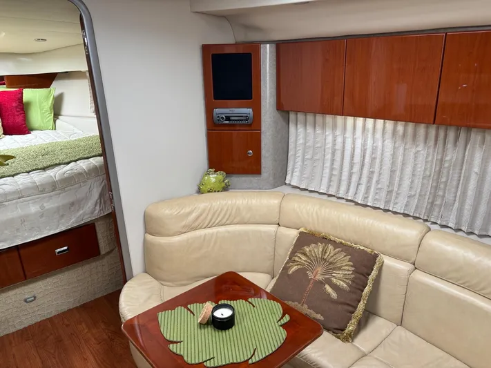 Cookin' Yacht Photos Pics Interior of a 2008 Formula 37 PC yacht with beige seating and wooden accents.