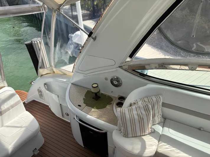 Cookin' Yacht Photos Pics Interior of 2008 Formula 37 PC yacht with seating and kitchenette area.