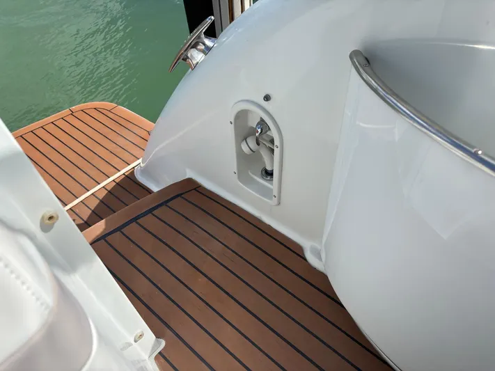 Cookin' Yacht Photos Pics 2008 Formula 37 PC boat deck with teak flooring and stainless steel railing.